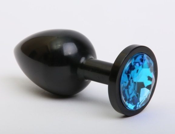 Чёрная анальная пробка с голубым стразом - 8,2 см. Чёрная анальная пробка с голубым стразом - 8,2 см.