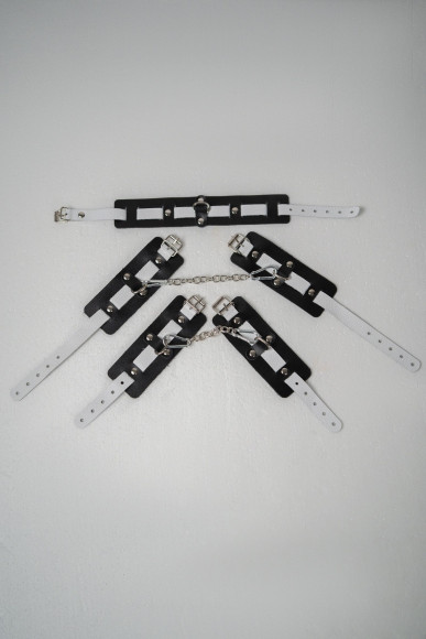 Набор фиксаторов из черной и белой натуральной кожи Набор фиксаторов из черной и белой натуральной кожи